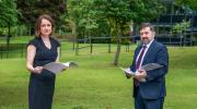 Prof Siobhan O'Neill with Health Minister Robin Swann