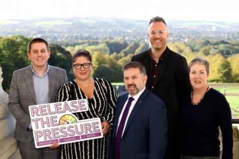 (l-r) Craig Harrison, Carers NI; Inspire CEO Kerry Anthony MBE; Minister of Health Robin Swann MLA; Jonny Currie, Trussell Trust; Eithne Gilligan, Age NI