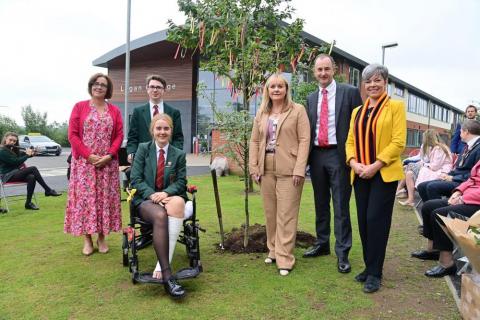 Lagan College at 40: (l-r) Principal Amanda McNamee, head boy Jude Hinds, head girl Rosa Day, Education Minister Michelle McIlveen, former pupils Richard Sherry and Clare Bailey MLA