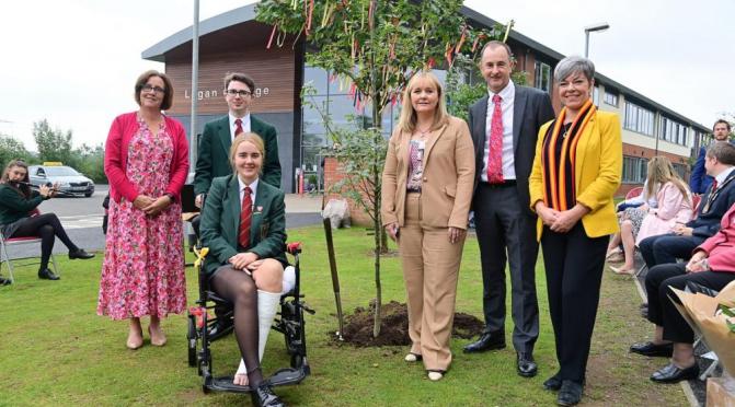 Lagan College at 40: (l-r) Principal Amanda McNamee, head boy Jude Hinds, head girl Rosa Day, Education Minister Michelle McIlveen, former pupils Richard Sherry and Clare Bailey MLA